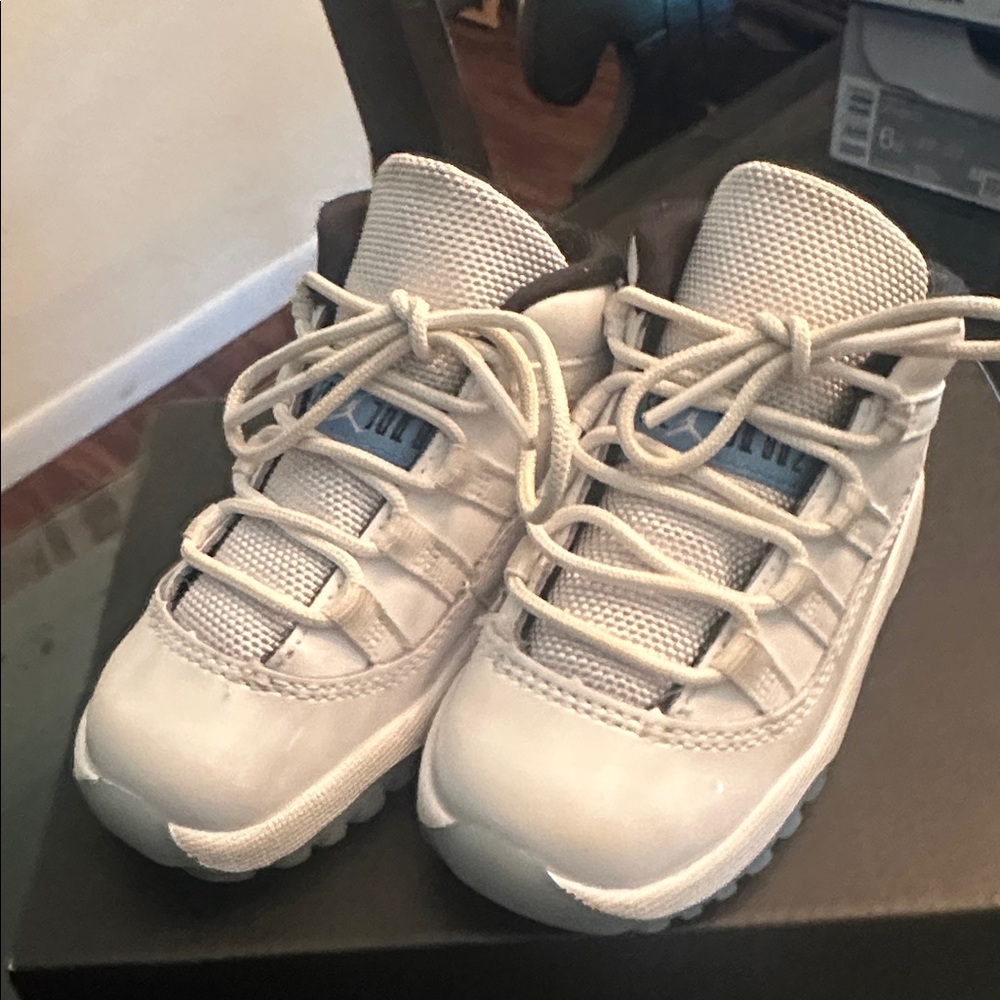 Jordan 11 Retro White and Blue Sneakers